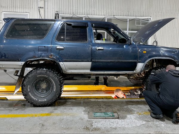 VTNZ staff and police look over one of many vehicles pulled off the road by police in Southland...