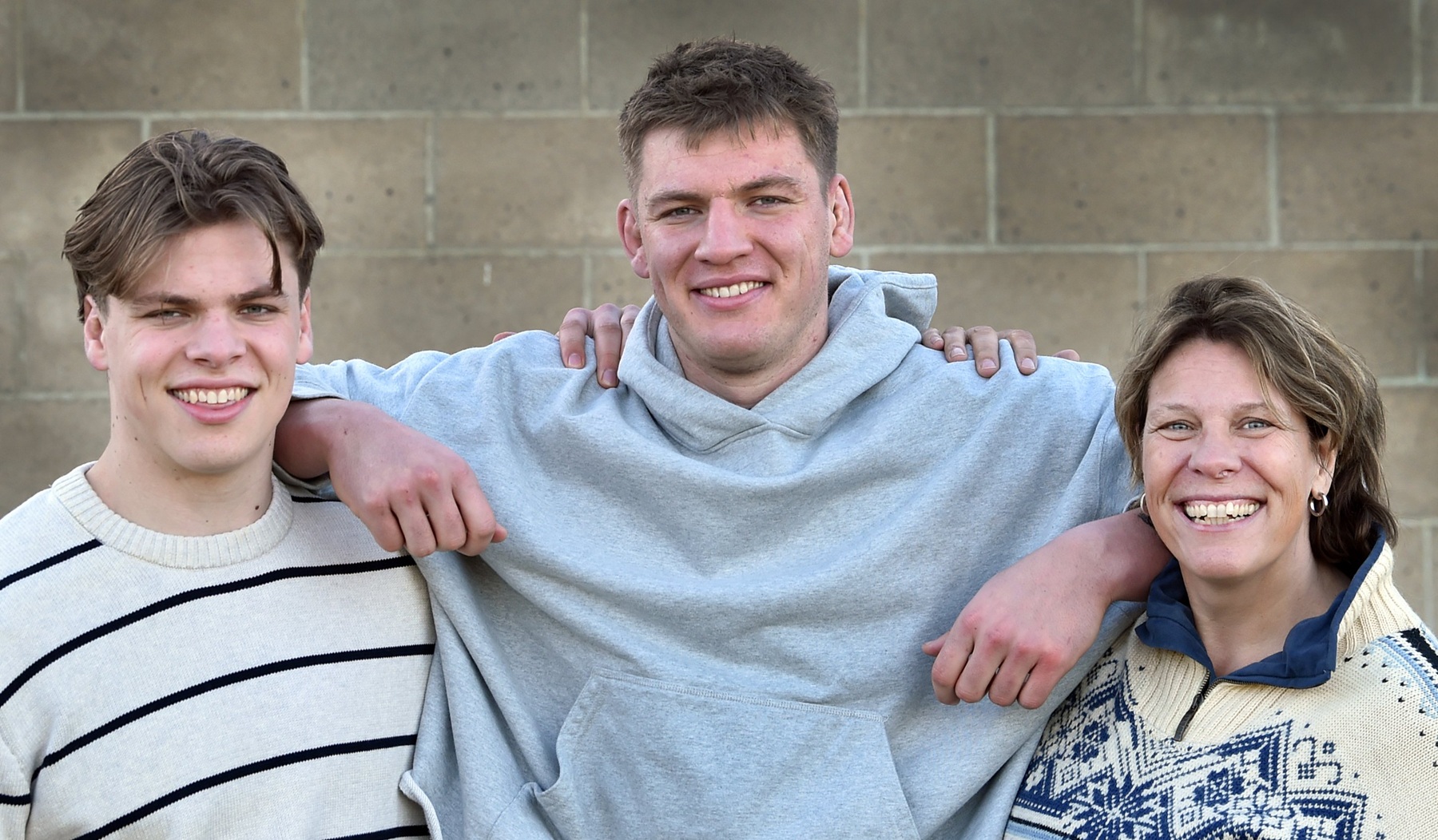 New All Black Fabian Holland (centre) with brother Quinten and mum Margot at the Dunedin Rugby...