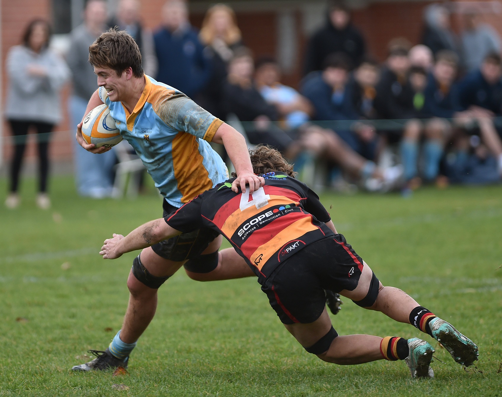 Zingari-Richmond lock Ratunui Latus tries to bring down University flanker Matt Brock at Logan...