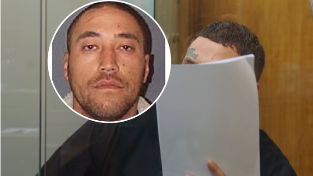 Wiremu Johnson shielded his face during sentencing in the Nelson District Court on rape and drugs...