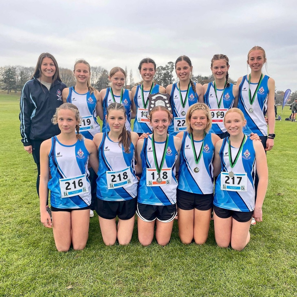 Queen’s High School teacher Anna Cross (back left) with her cross-country team. Photos: supplied

