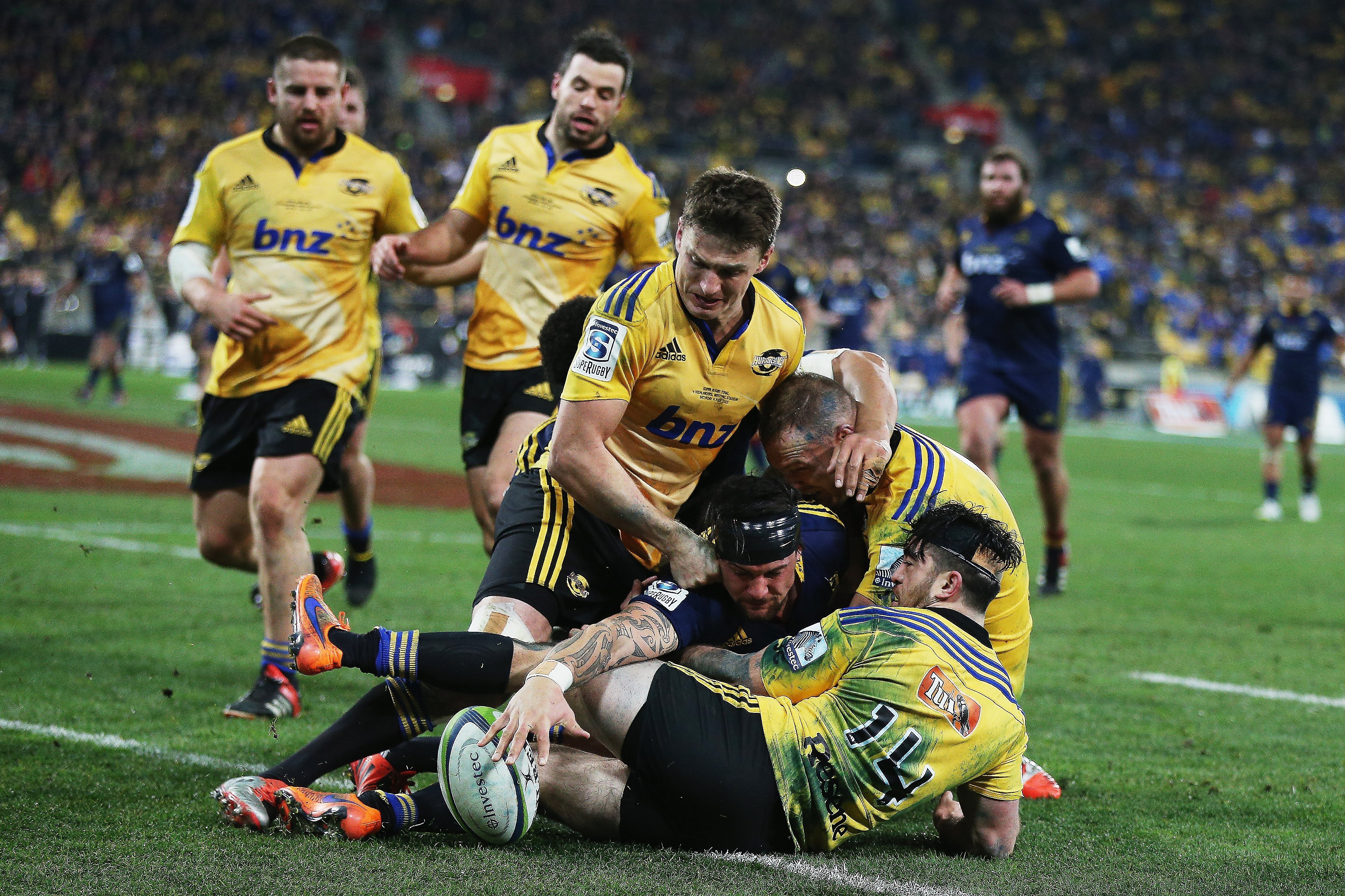 Highlanders loose forward Elliot Dixon scores during the Super Rugby final.

