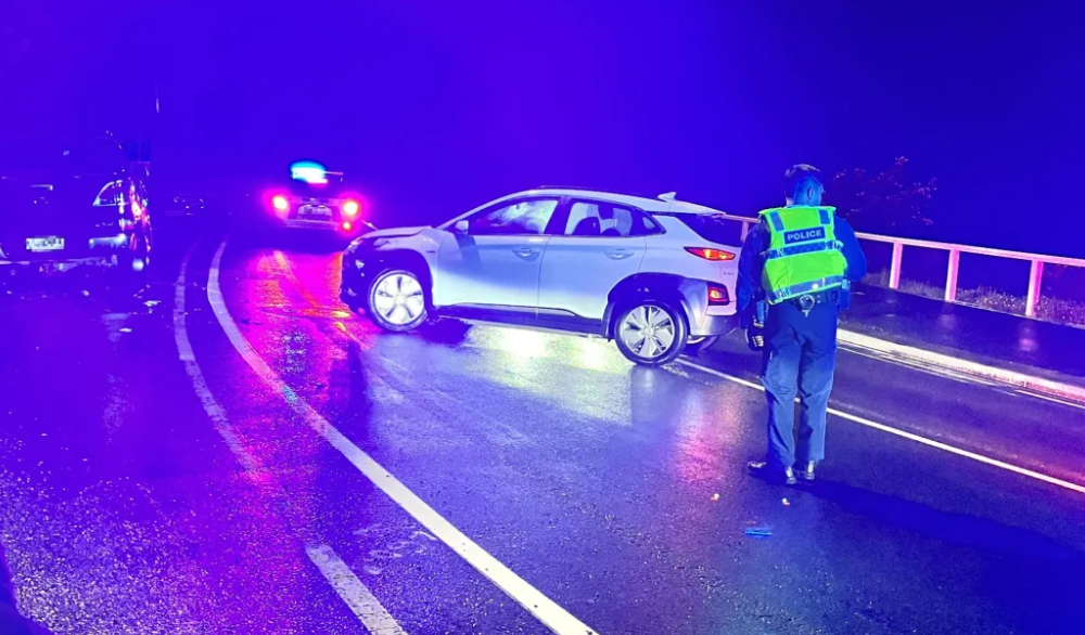 A Hyundai Kona - a electric car available to government ministers - blocks one lane on a...