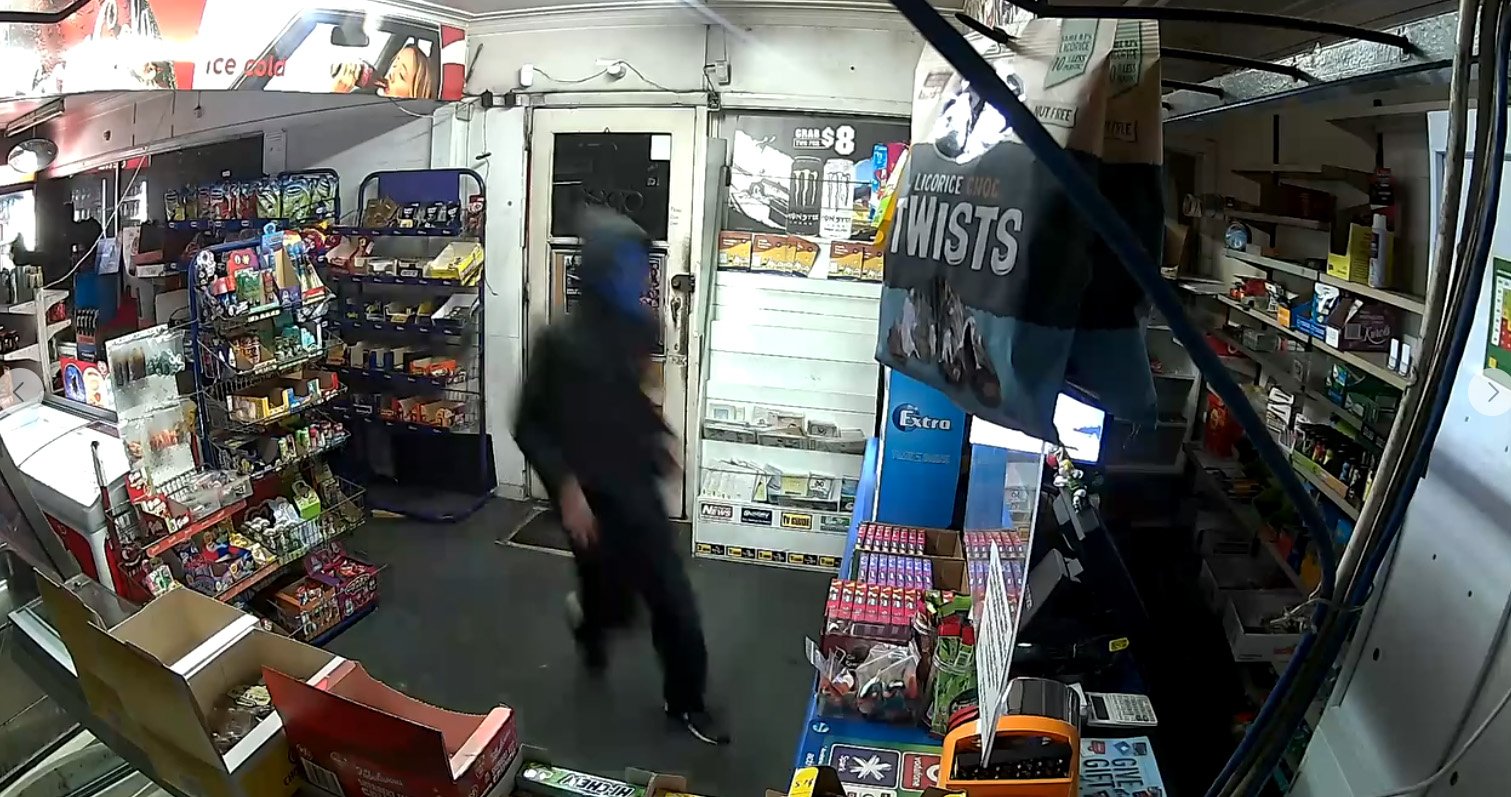 An intruder wearing a blue mask was one of two burglars caught on camera breaking into the...