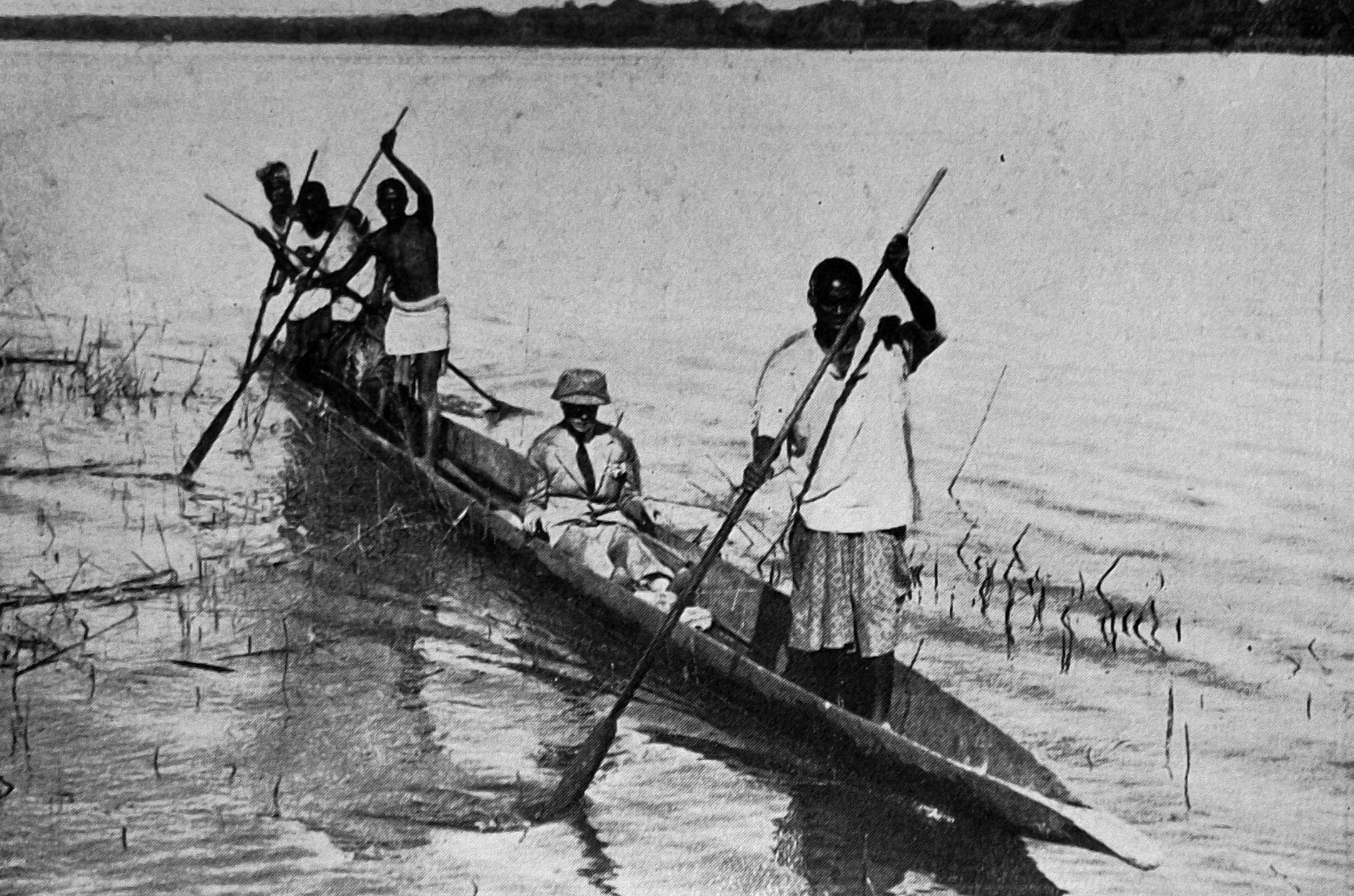 Edward, Prince of Wales is transported in a dug-out canoe on the Zambezi River near Kamujoma,...