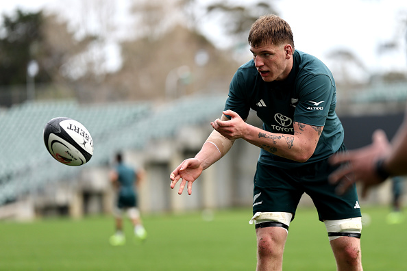 Fabian Holland passes a ball at All Blacks training in Auckland on Tuesday. Photo: Getty Images