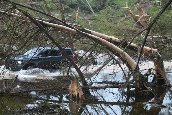 A vehicle drives over a low water bridge yesterday in Hunt, Texas. Photo: Getty Images