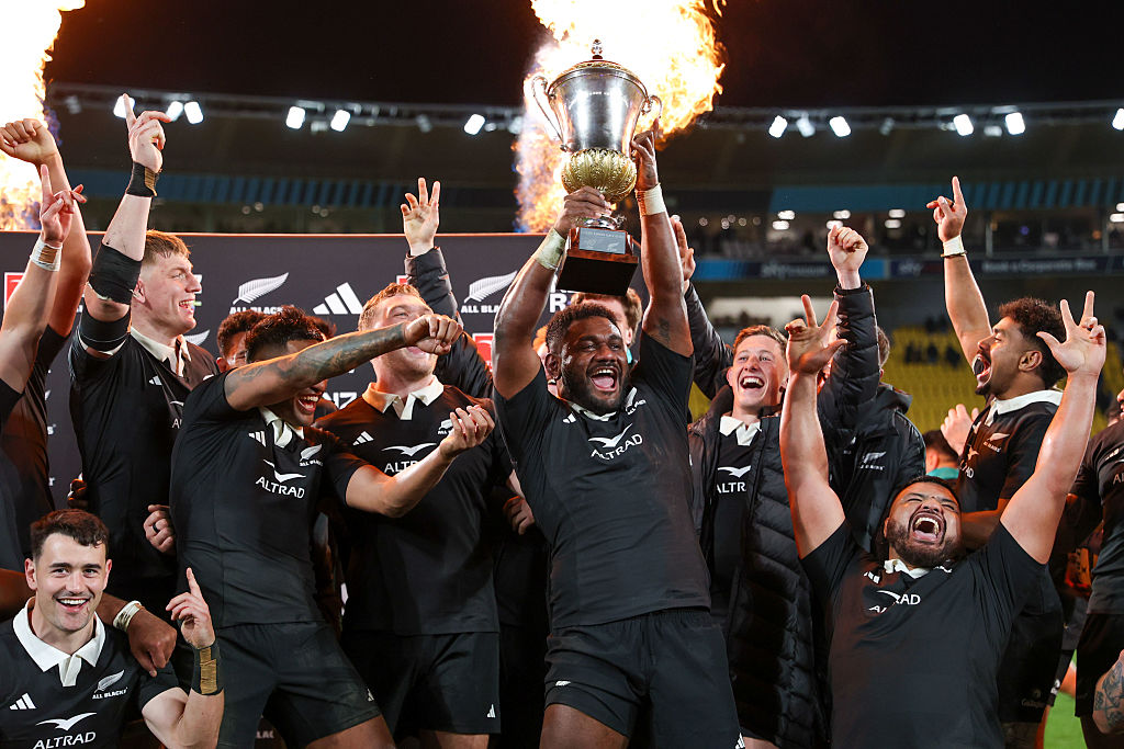 Timoci Tavatavanawai lifts the trophy as the All Blacks celebrate their series victory against...