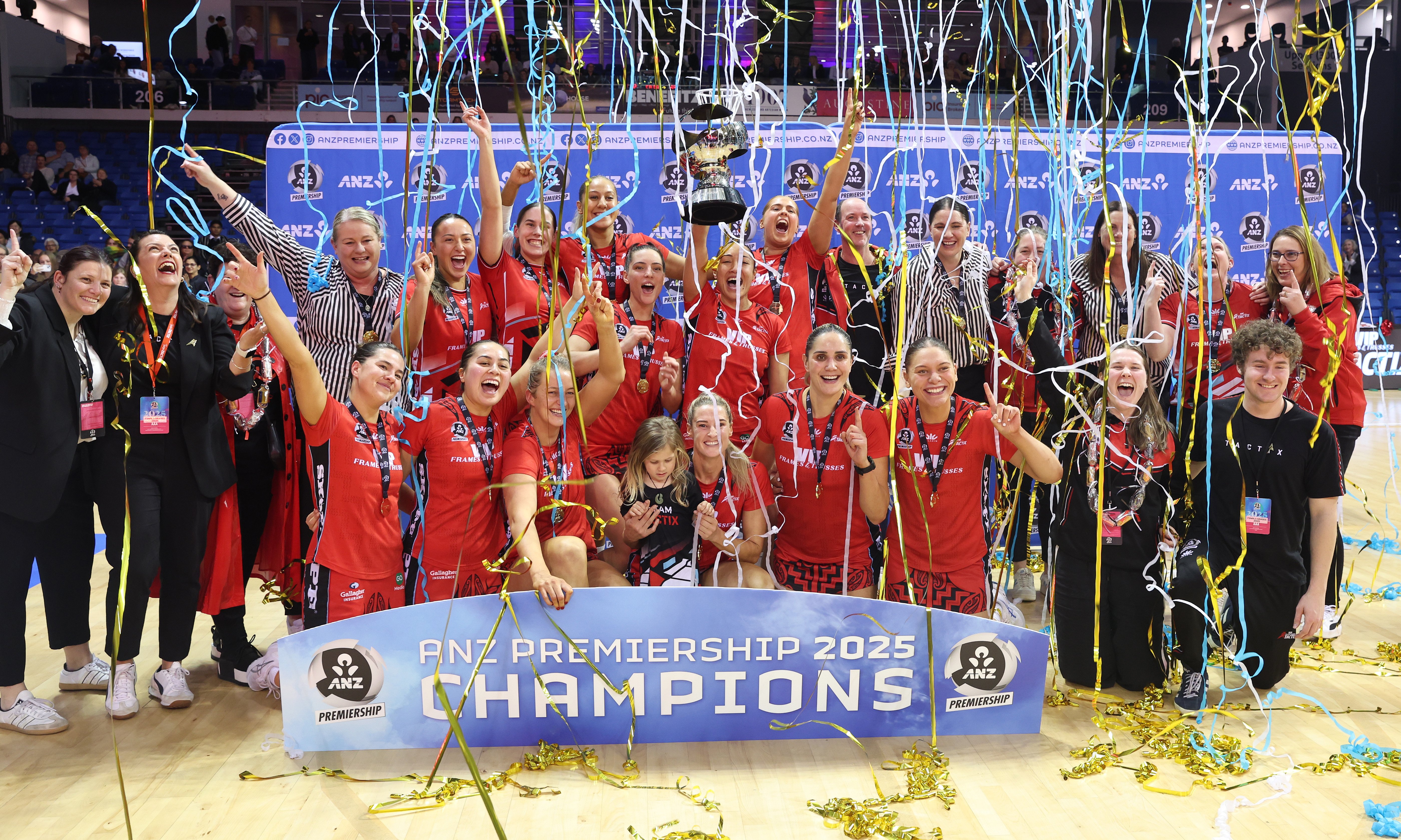 The Mainland Tactix celebrate their first national netball title, in Auckland, last night. PHOTOS...