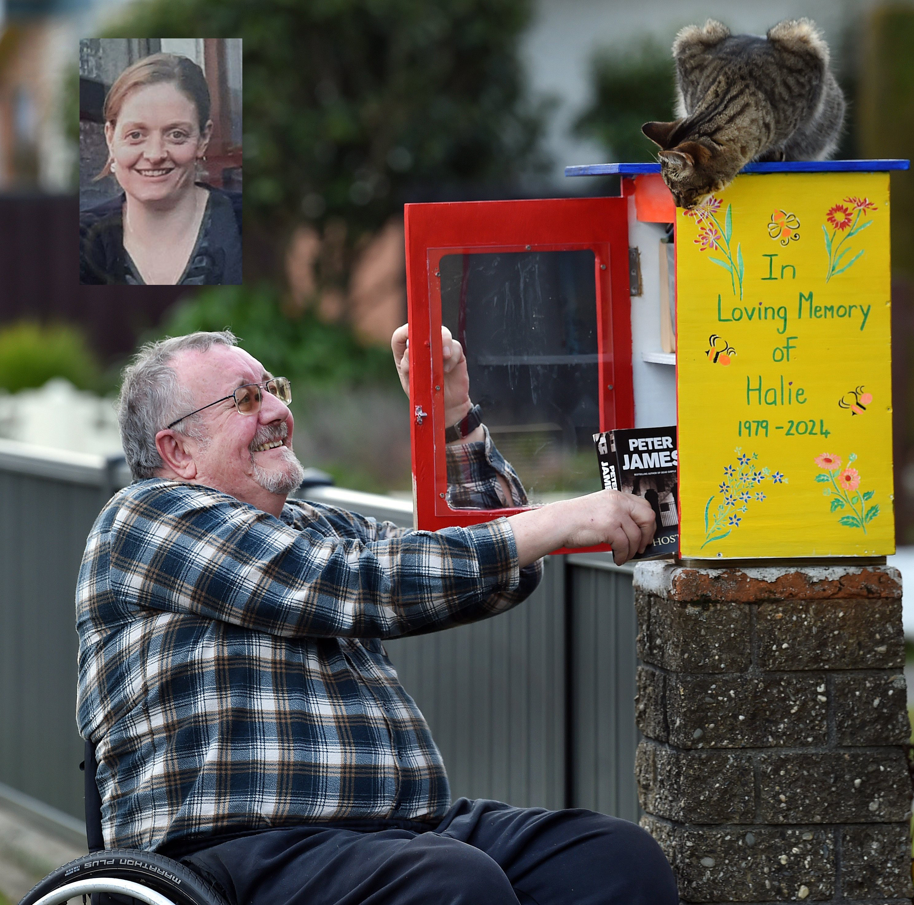 Halie McEachen’s father, Stu McEachen, pulls a book from the Lilliput library he built in memory...