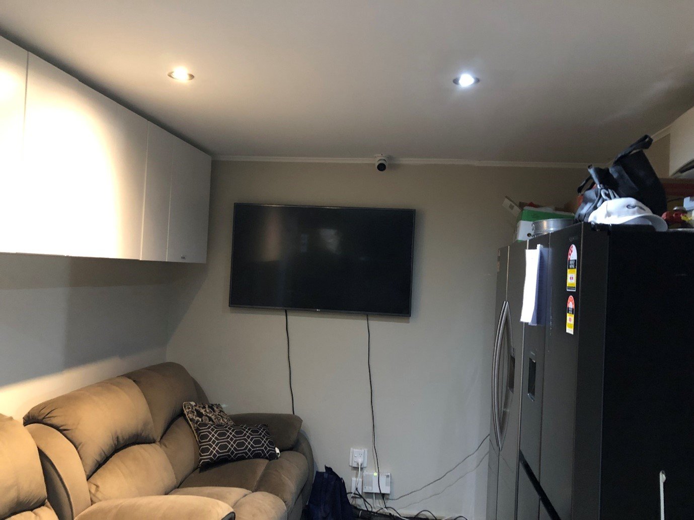 The living area for 22 tenants had security cameras on the wall.