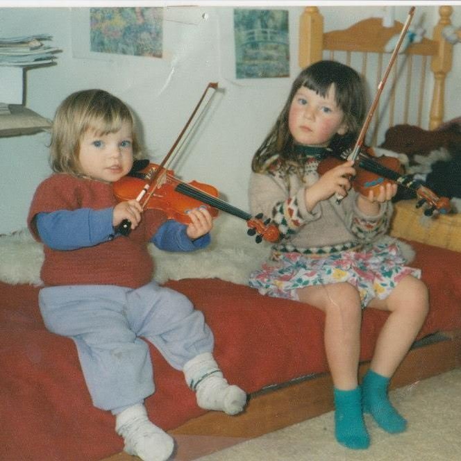 A young Natasha Manowitz and her sister (now known as Rainbow Rosalind) with their violins. Photo...