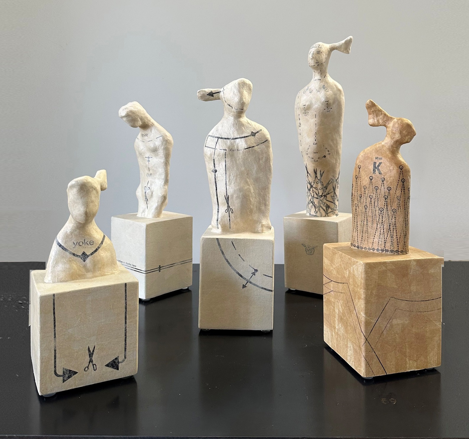 The Crucibles (above) are created from a tough granite plaster and covered with vintage sewing...