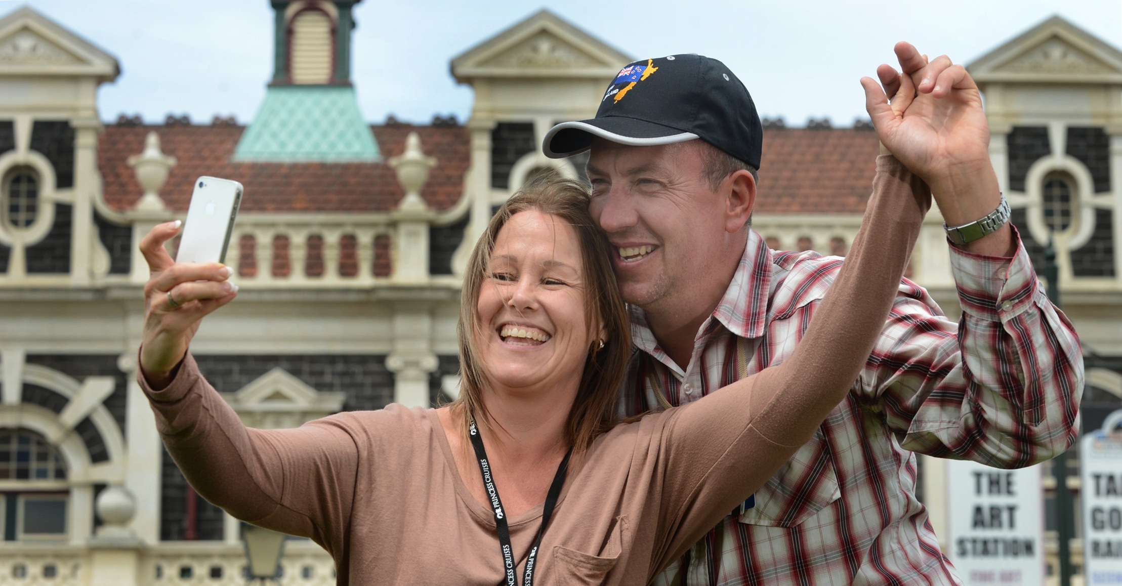 Melbourne couple Kerryn and Danny Robinson take a selfie in front of the Dunedin Railway Station....