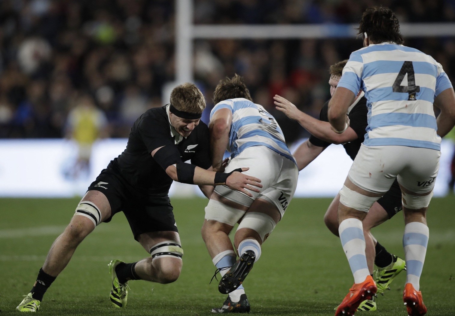 New Zealand's Fabian Holland puts a tackle in on Argentina's Pedro Rubiolo. Photo: Reuters