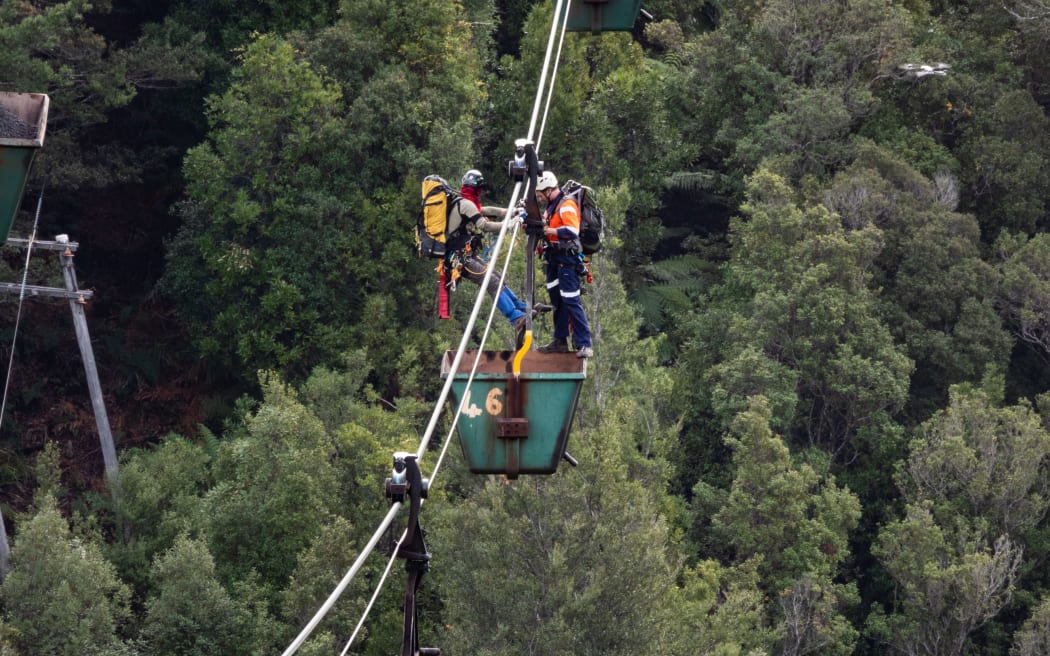 Two Climate Liberation Aotearoa protesters used the aerial rope way down to Ngakawau to access a...