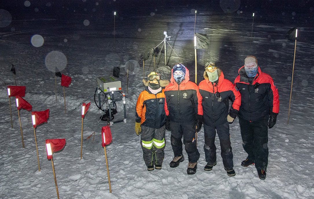 Braving the midwinter conditions at noon near Scott Base, are (from left) science technician Hue...