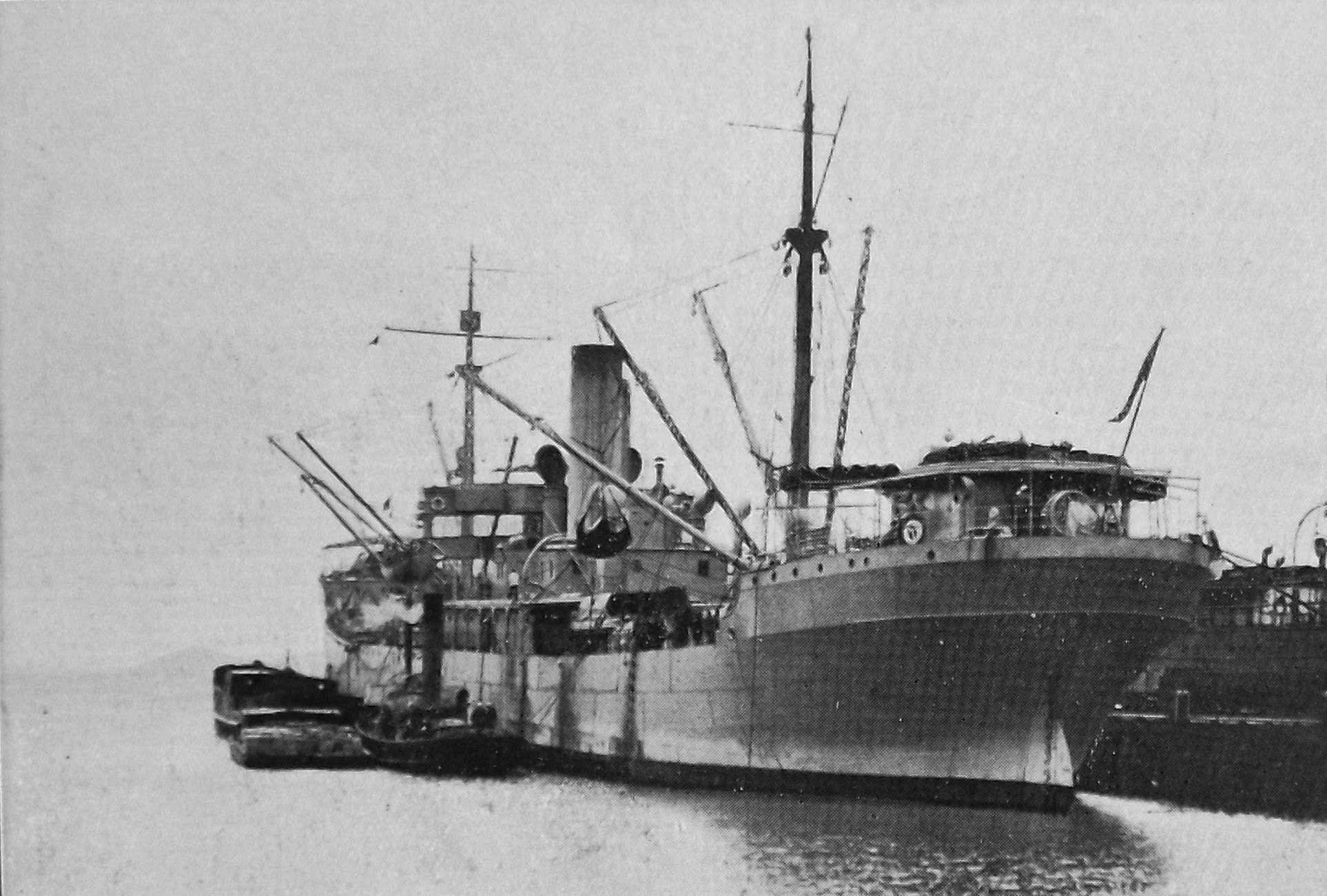 US Navy supply ship USS Arctic unloads stores at Port Chalmers for the visiting naval fleet. —...