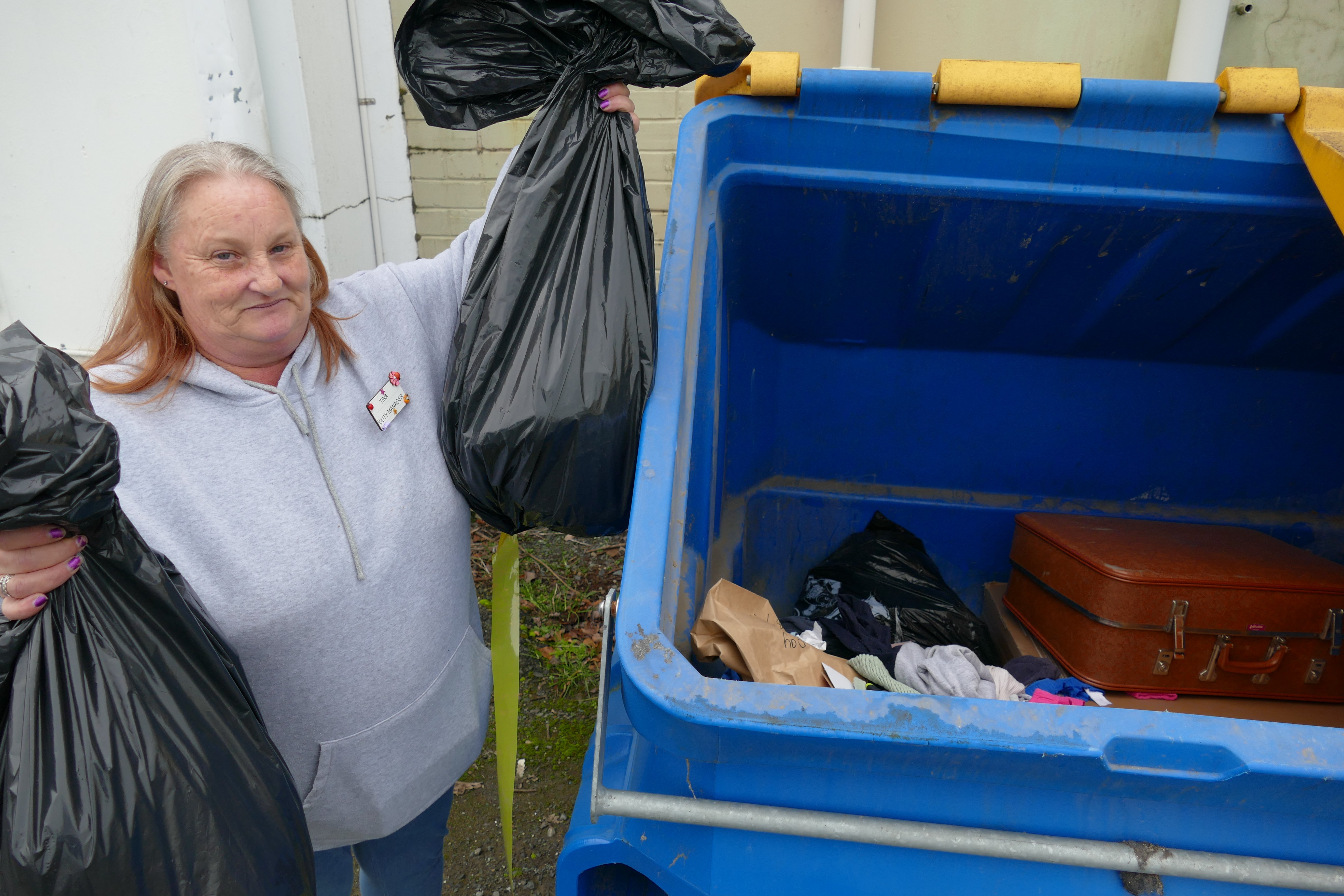 Balclutha Op Shop duty manager Tina Johnson disposes of unsaleable waste at the Clyde St store...