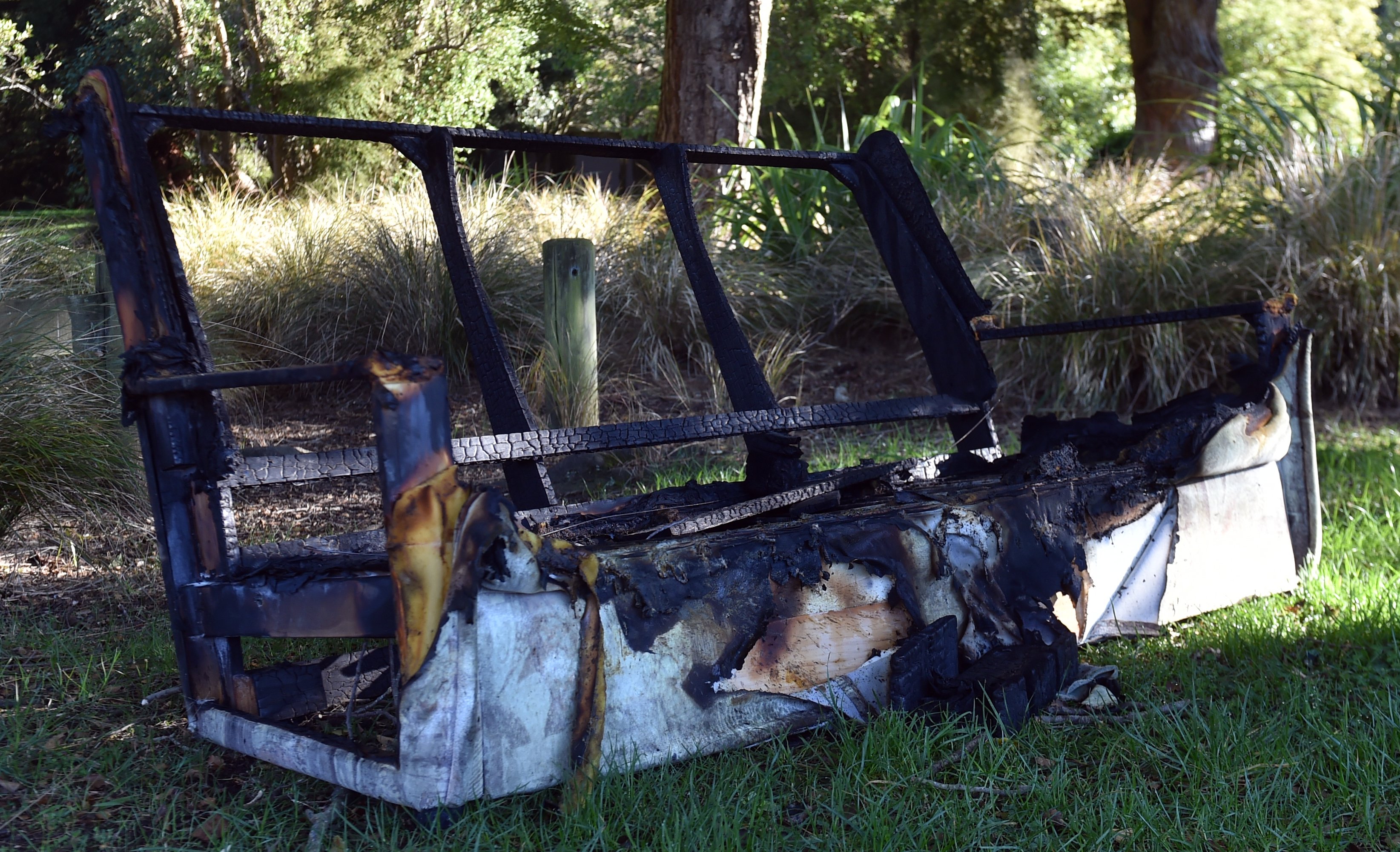 A burnt couch sits near the entrance of Woodhaugh Gardens, on George St yesterday morning. PHOTO:...