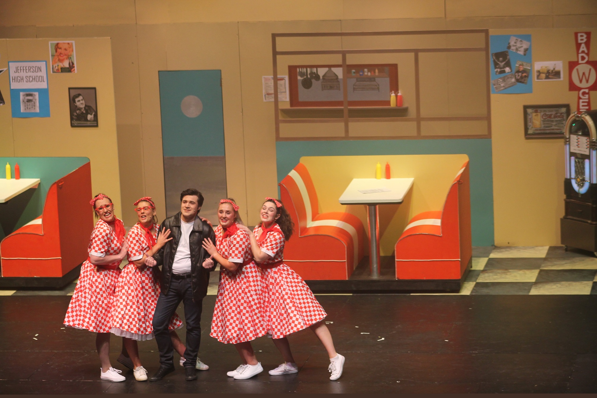 Billy Weeks plays the Fonz, accompanied by the chorus line of Wendy Cook, Taylor Thompson, Anah...