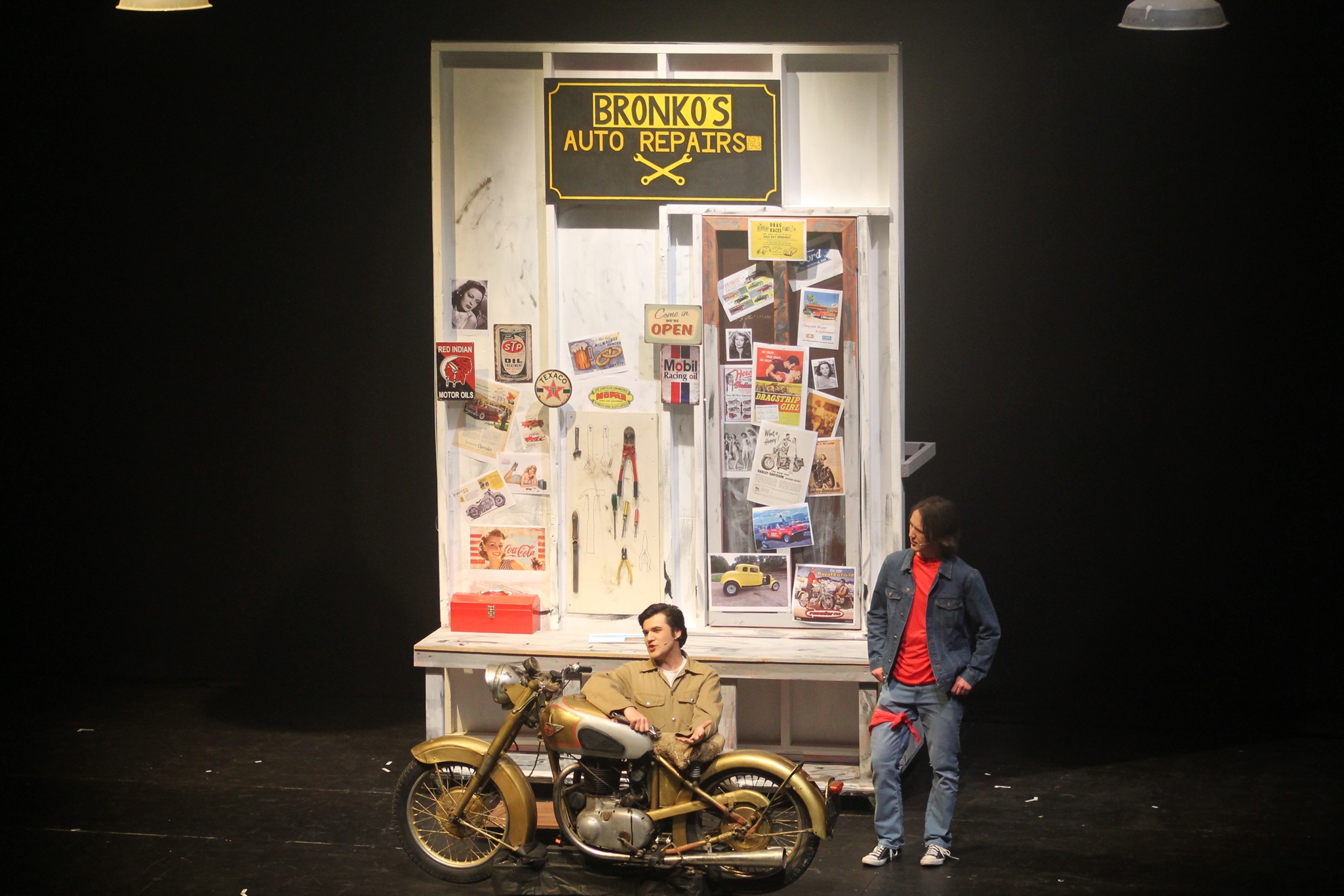 Billy Weeks as the Fonz and Samuel McGregor as Chachi perform a number in Fonzie’s workshop.

