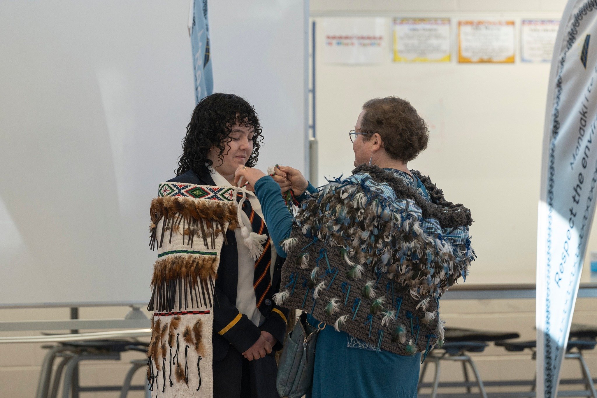 Weaver Helen Wilson of Balfour fastens a kākahu she made for Northern Southland College around...