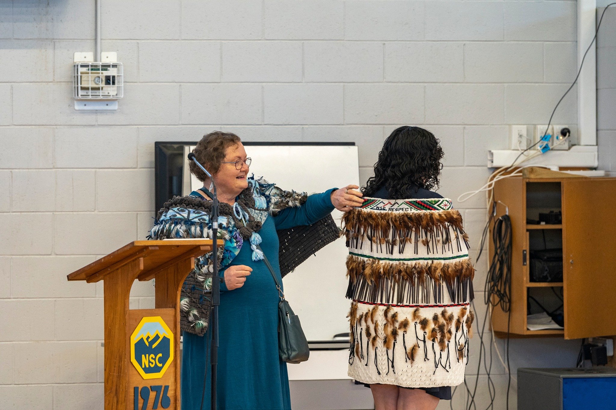 Weaver Helen Wilson of Balfour talks about the elements on the back of the kakahu.
