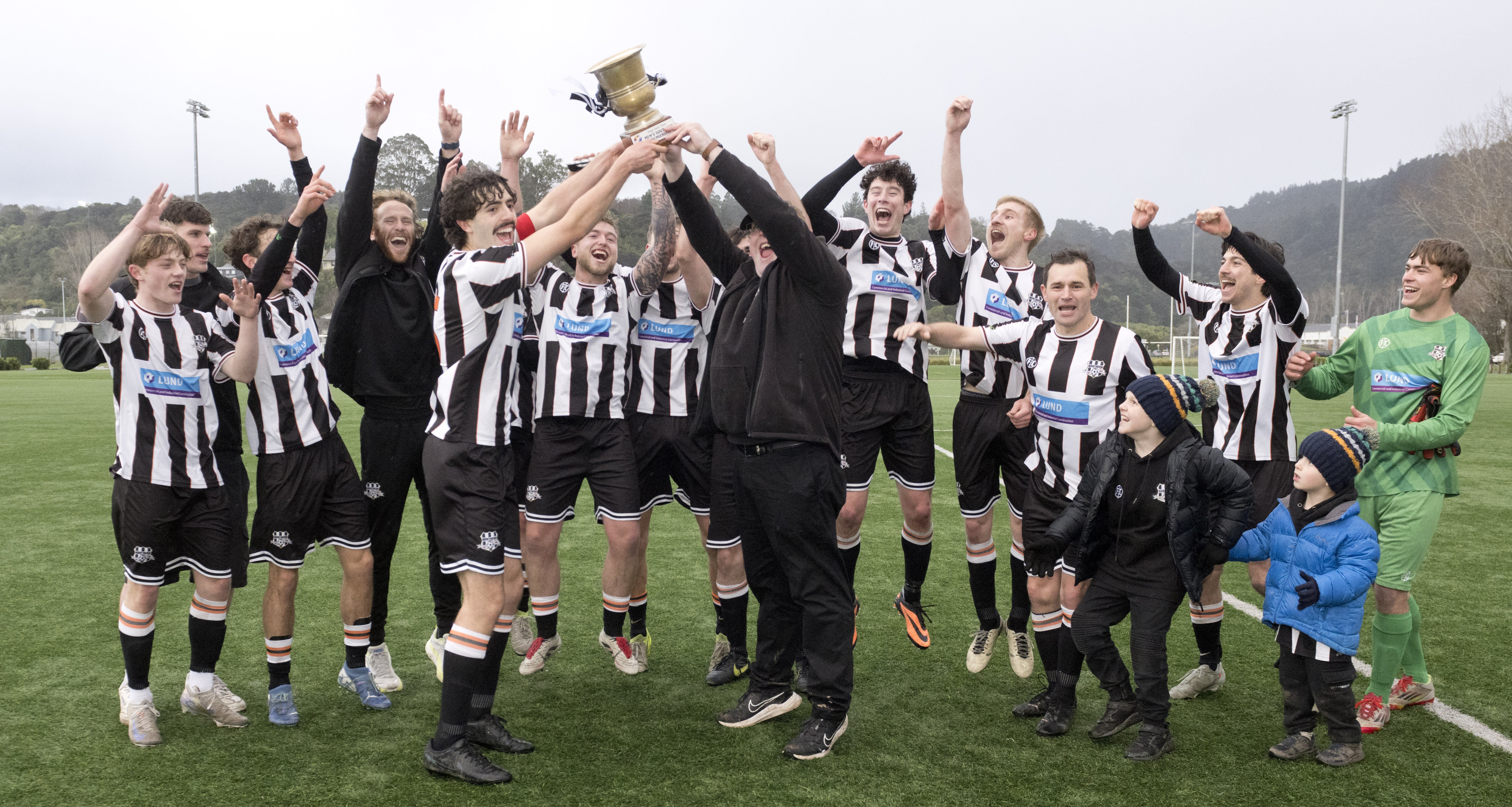 Captain Luka Mandich (left) and manager Nick Currie celebrate after Northern clinched the ODT...