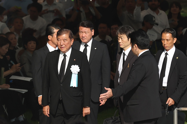 Japanese Prime Minister Shigeru Ishiba arrives for the 80th anniversary ceremony of the atomic...