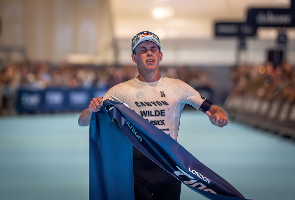 Hayden Wilde crosses the finish line at the London T100 Triathlon on Saturday. Photo: T100...