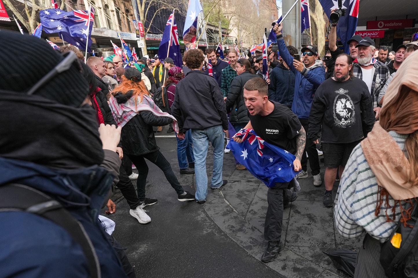 Protesters clashed in Melbourne, with some scuffles between the two groups. Photos: Getty Images
