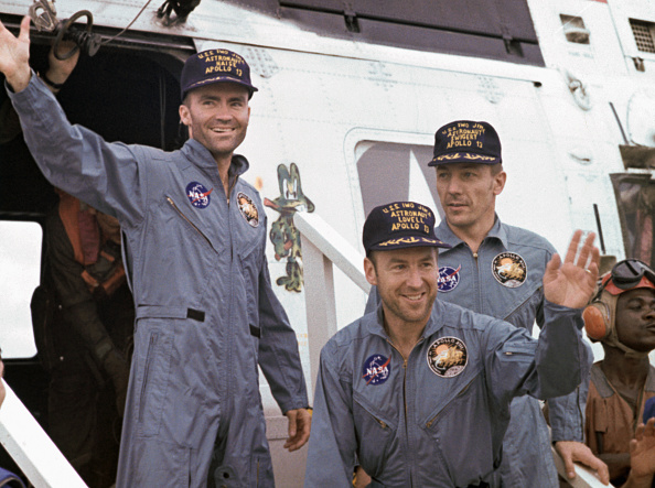Apollo 13 astronauts (from left) Fred Haise, James Lovell and John Swigert arrive safely back on...