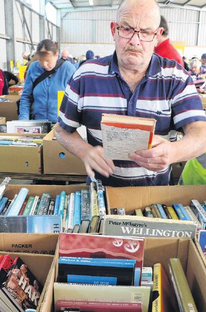 Richard Cording seeking out a good bargain at last year’s annual Rangiora Rotary Book Sale. PHOTO...
