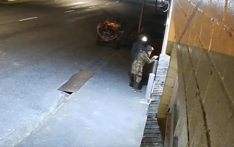A still image from the CCTV believed to show Tom Phillips and a child. Photo: NZ Police