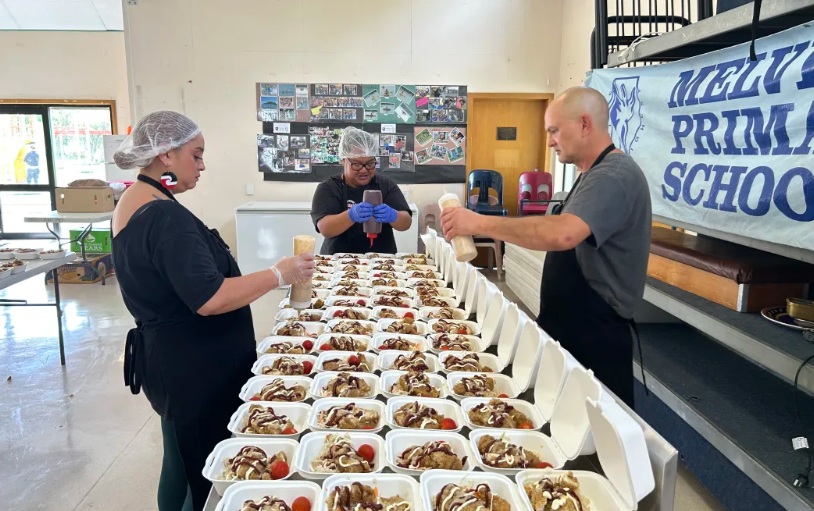 Kitchen staff prepare food for Melville Primary School pupils. Photo: Ke-Xin Li 