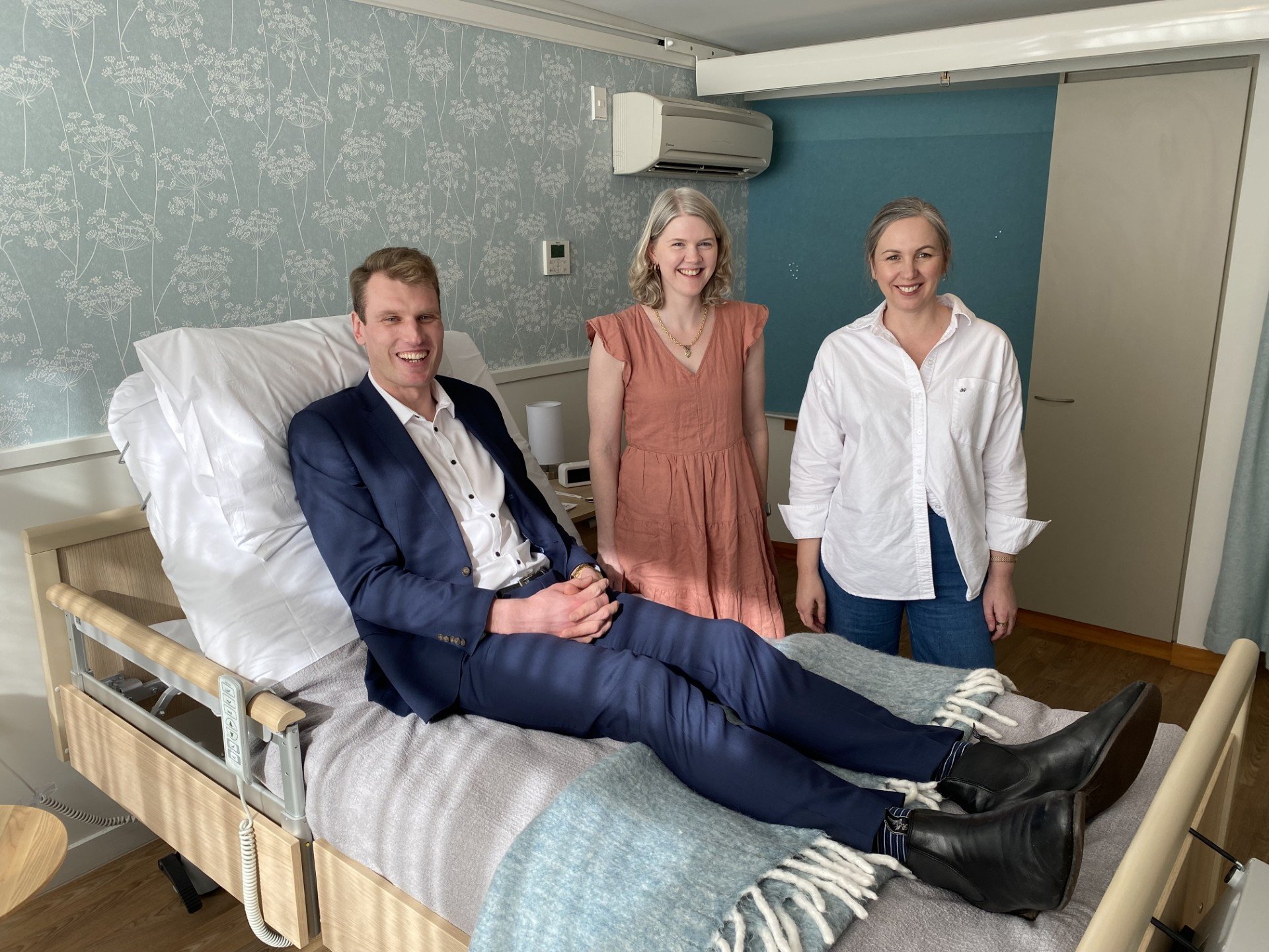 100+ People Who Care group founder Nick Berryman tries out a comfortable and safe new bed for in...