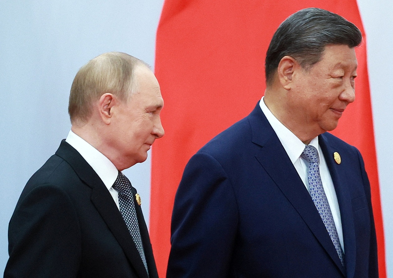 Russian President Vladimir Putin and Chinese President Xi Jinping take part in a photo ceremony...