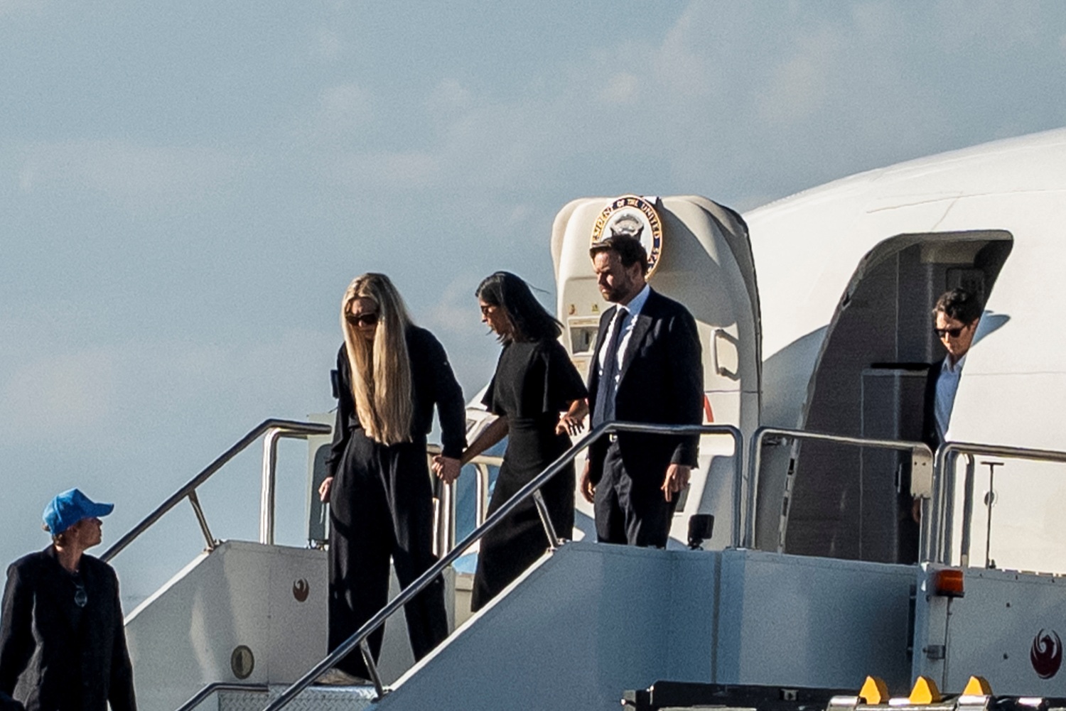 Erika Kirk, US Second Lady Usha Vance and US Vice President JD Vance exit Air Force Two, which is...