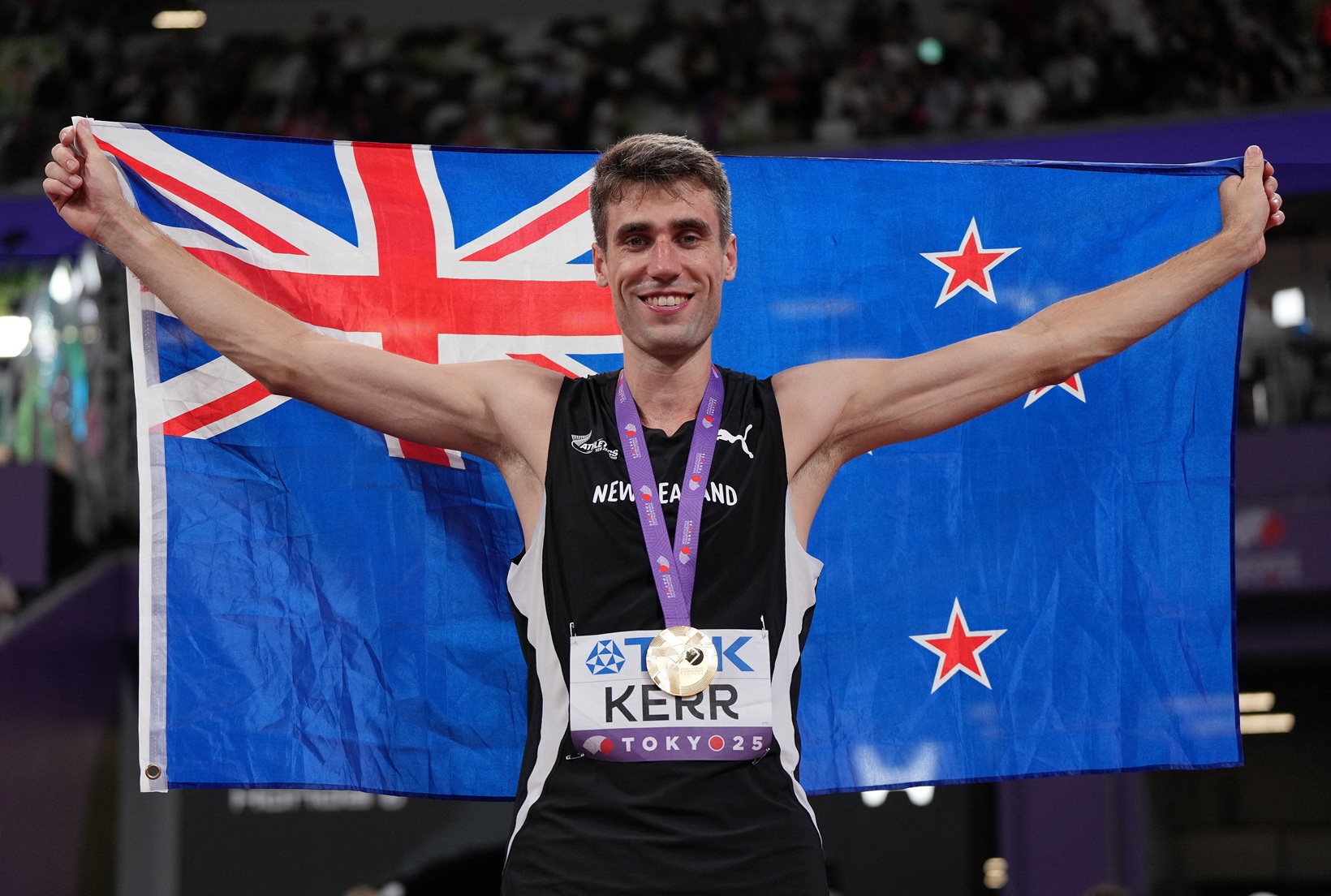 Hamish Kerr celebrates after winning gold in the high jump at the World Athletics Championships...