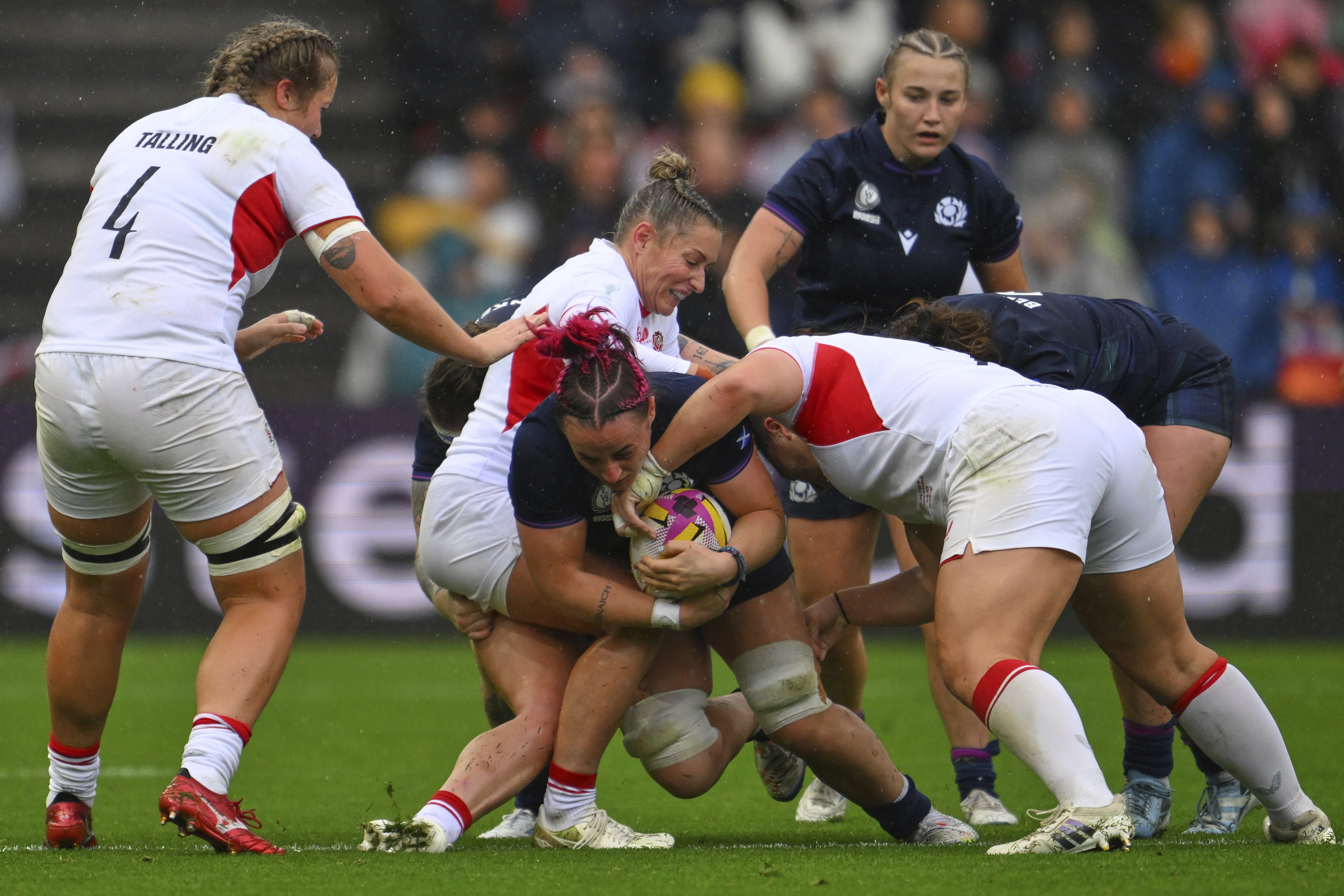 English defenders wrap up Scotland flanker Evie Gallagher during the Women’s Rugby World Cup...