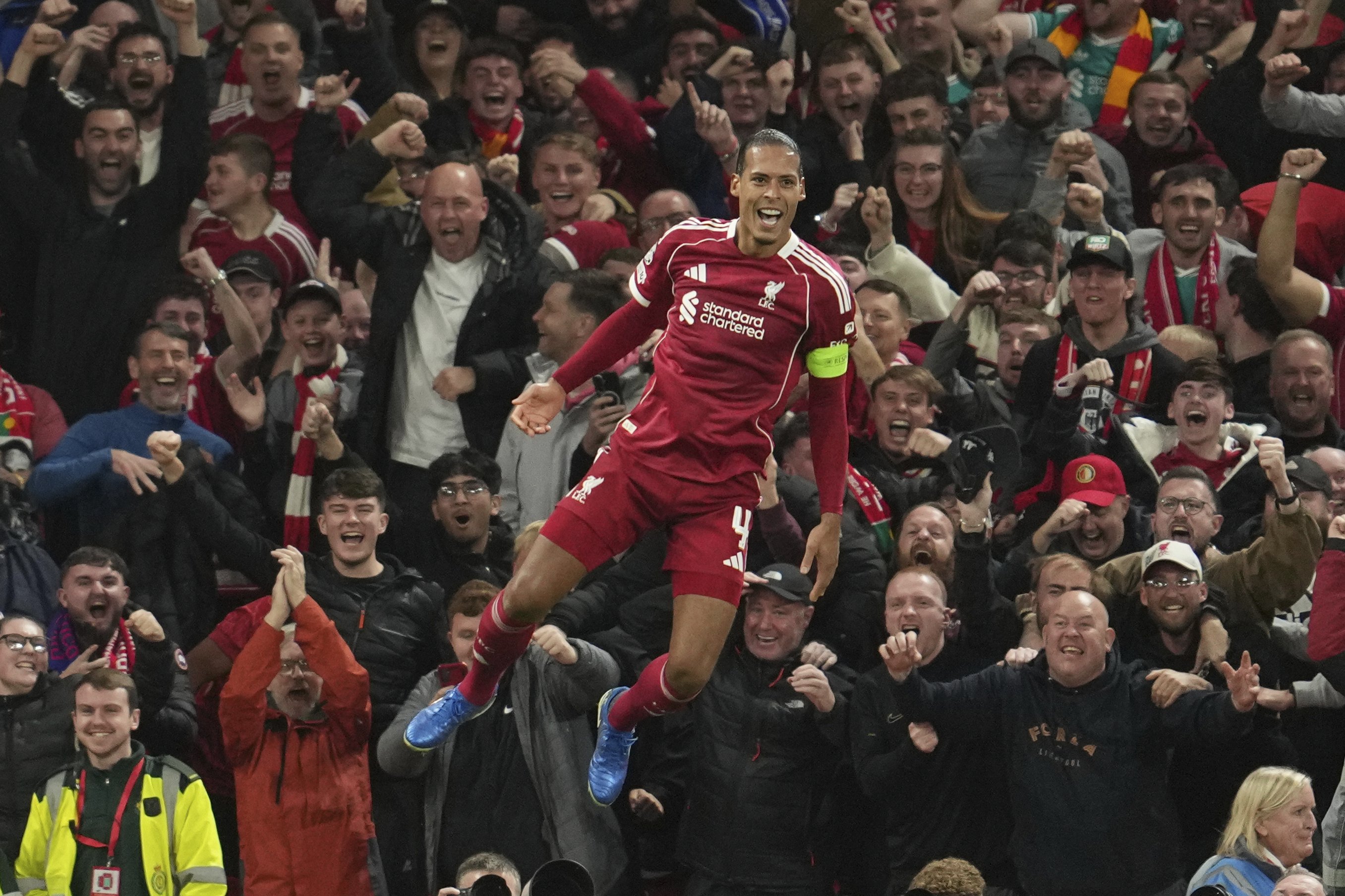 Liverpool captain Virgil van Dijk celebrates after scoring his side’s winning goal against...