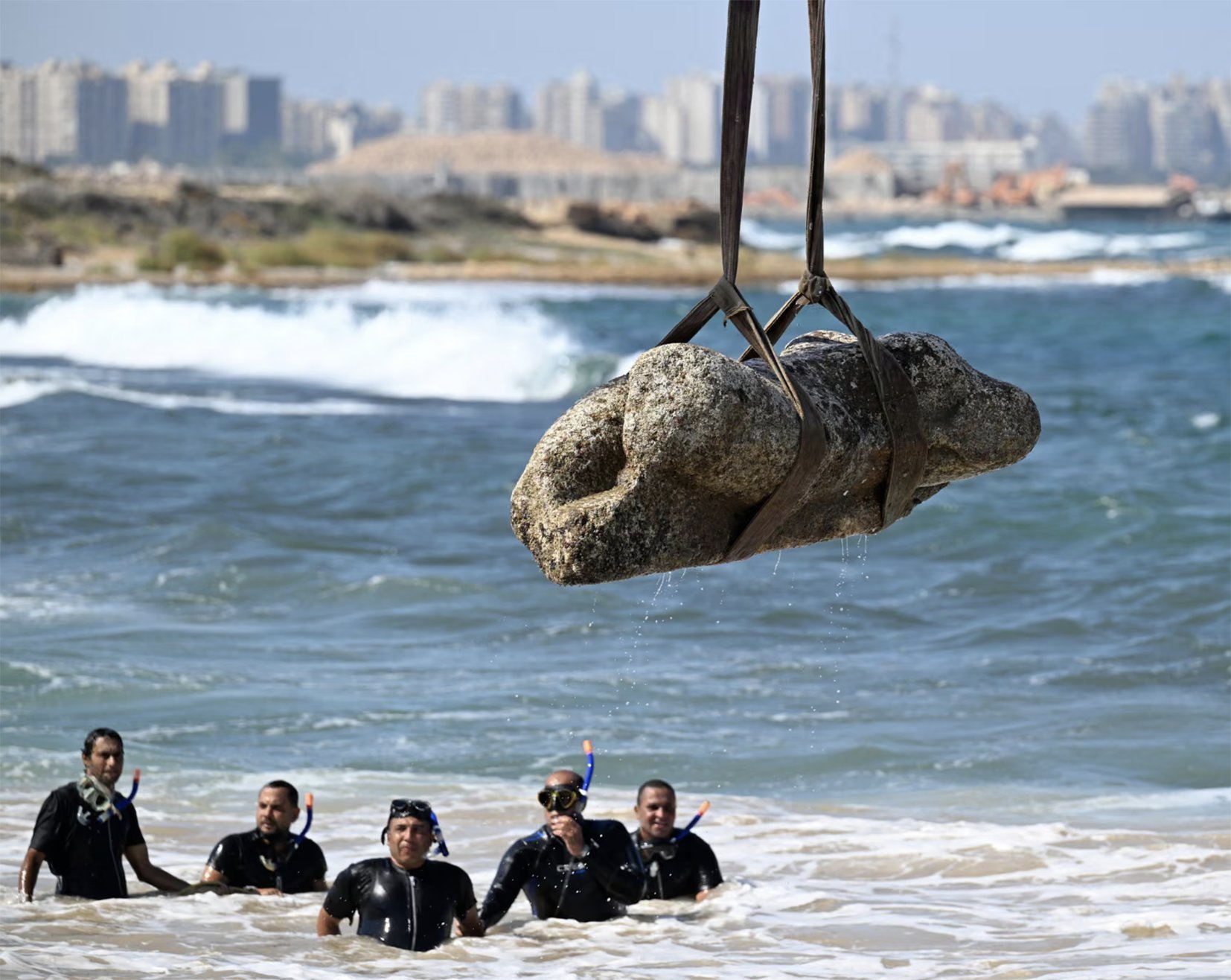 A crane hauls a statue from the sunken city of Canopus, Egypt. Photo: supplied