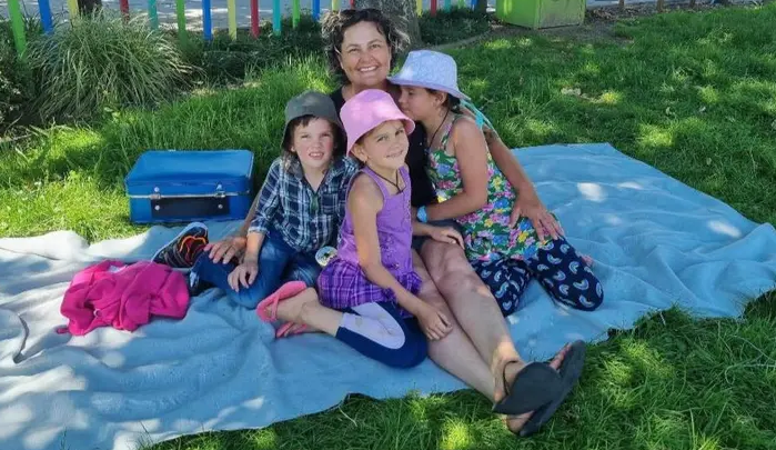 A photo posted on social media by Cat of her and the children in November 2021, a month before...