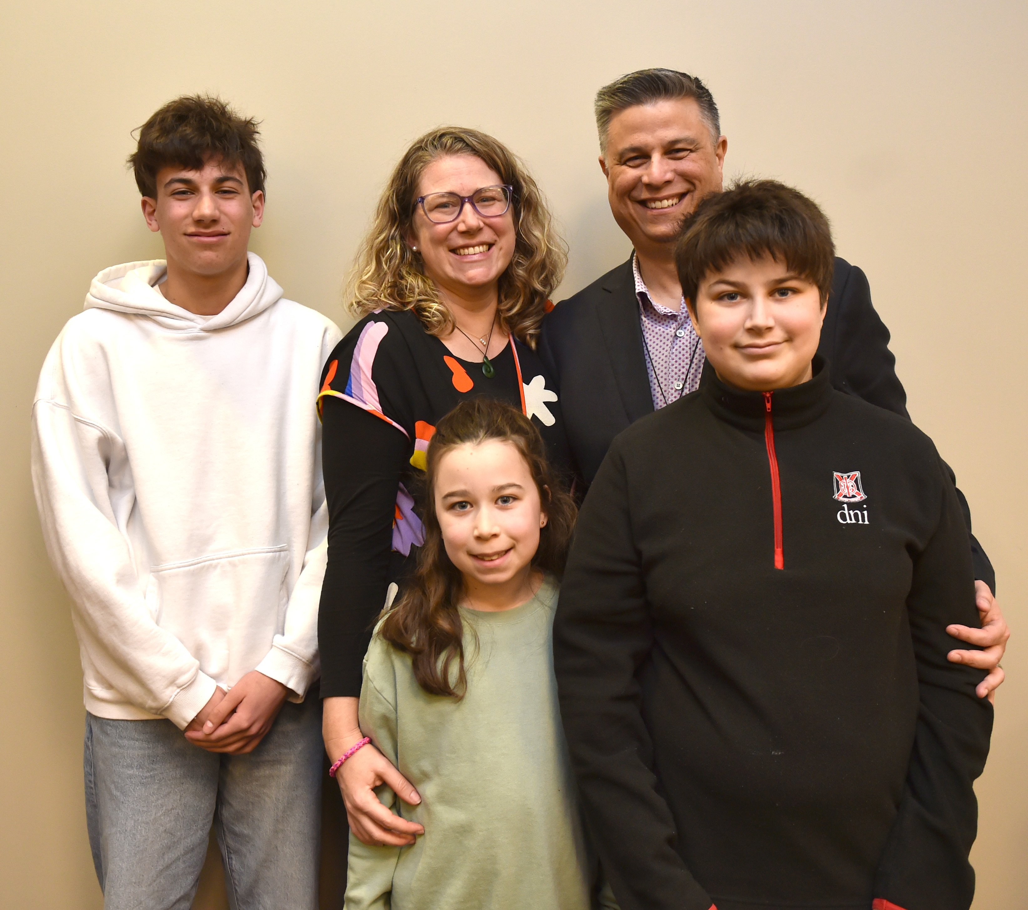 Posing for a family photo after gaining the New Zealand citizenship yesterday are (back, from...