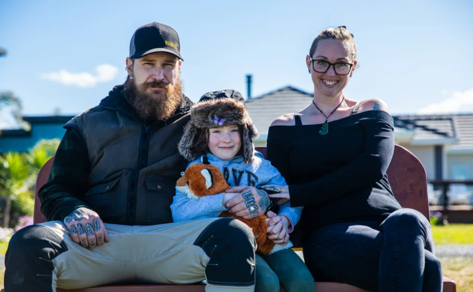 Jack and Ella Collins, with daughter Imogen, return to their Eskdale home. Photo: Nick Monro/RNZ 