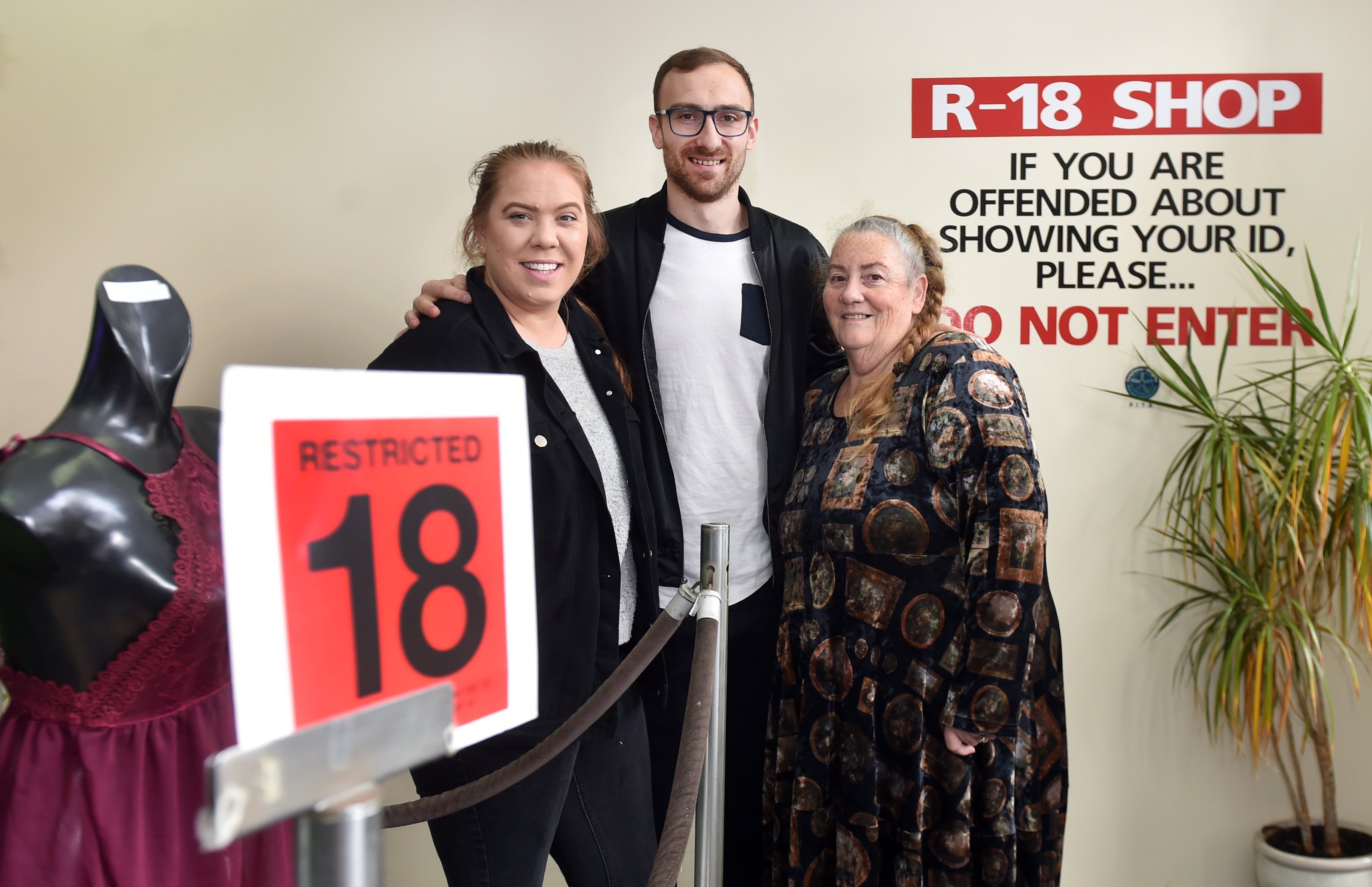 Standing in the foyer area of the now-closed Cupid Shop are (from left) co-owners Jenna and Tyler...
