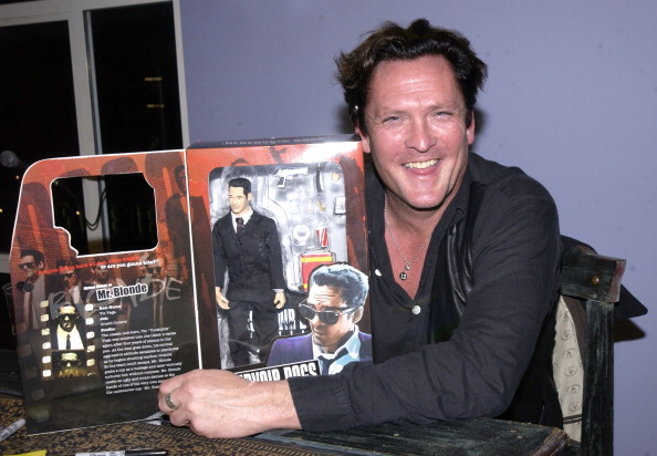 Michael Madsen poses with his action figure, Mr. Blonde, from Reservoir Dogs. Photo: Getty Images