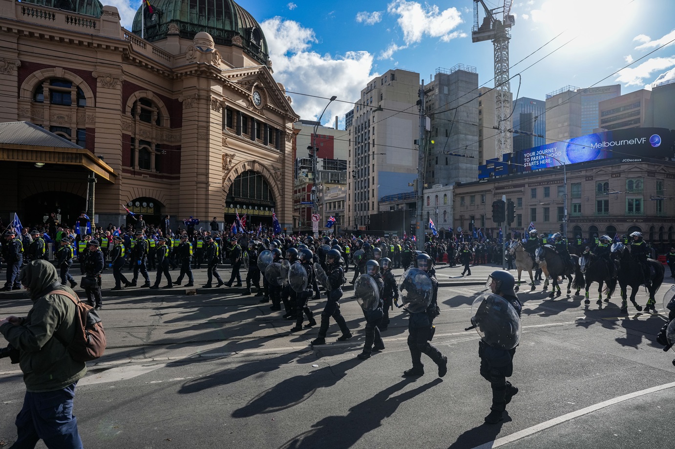 A strong police presence kept protesters separated during a rally in Melbourne at the weekend....