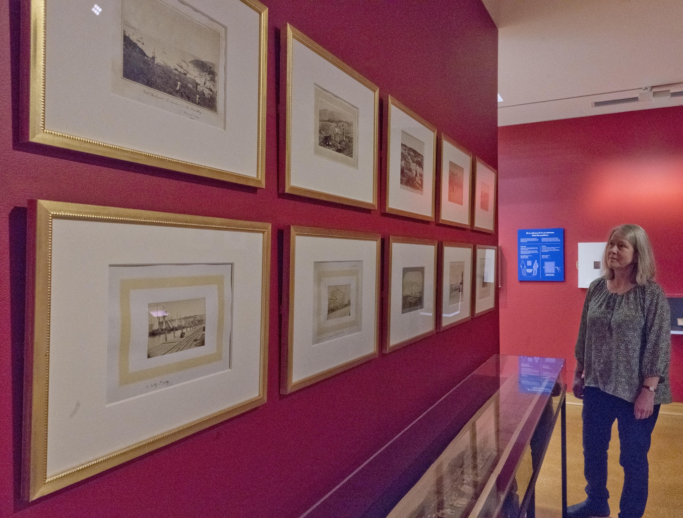 Hocken photography curator Dr Anna Petersen examines photographs from the Hocken collection that...